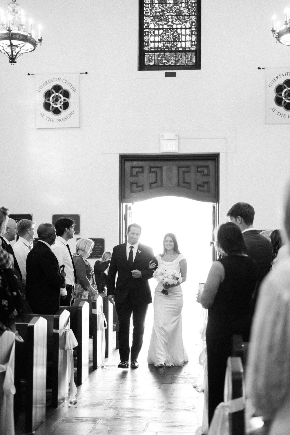 Presidio Chapel wedding ceremony photos. Father and daughter walking down the ailes.