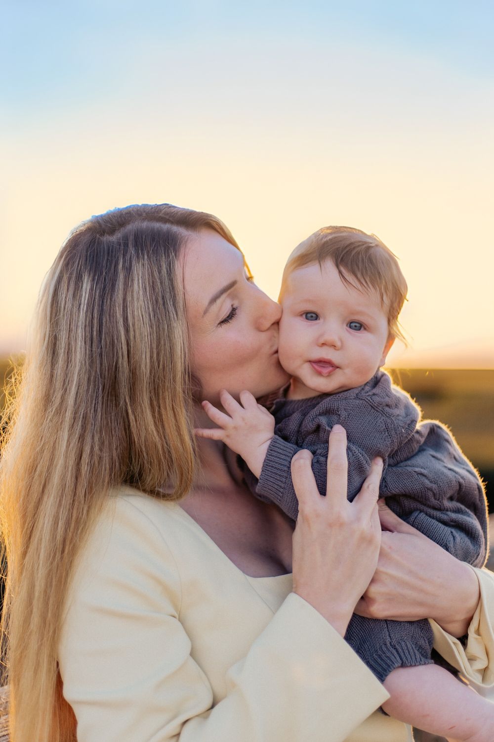 A tender moment captured at sunset showing affectionate interaction between parent and child in a series of photos.