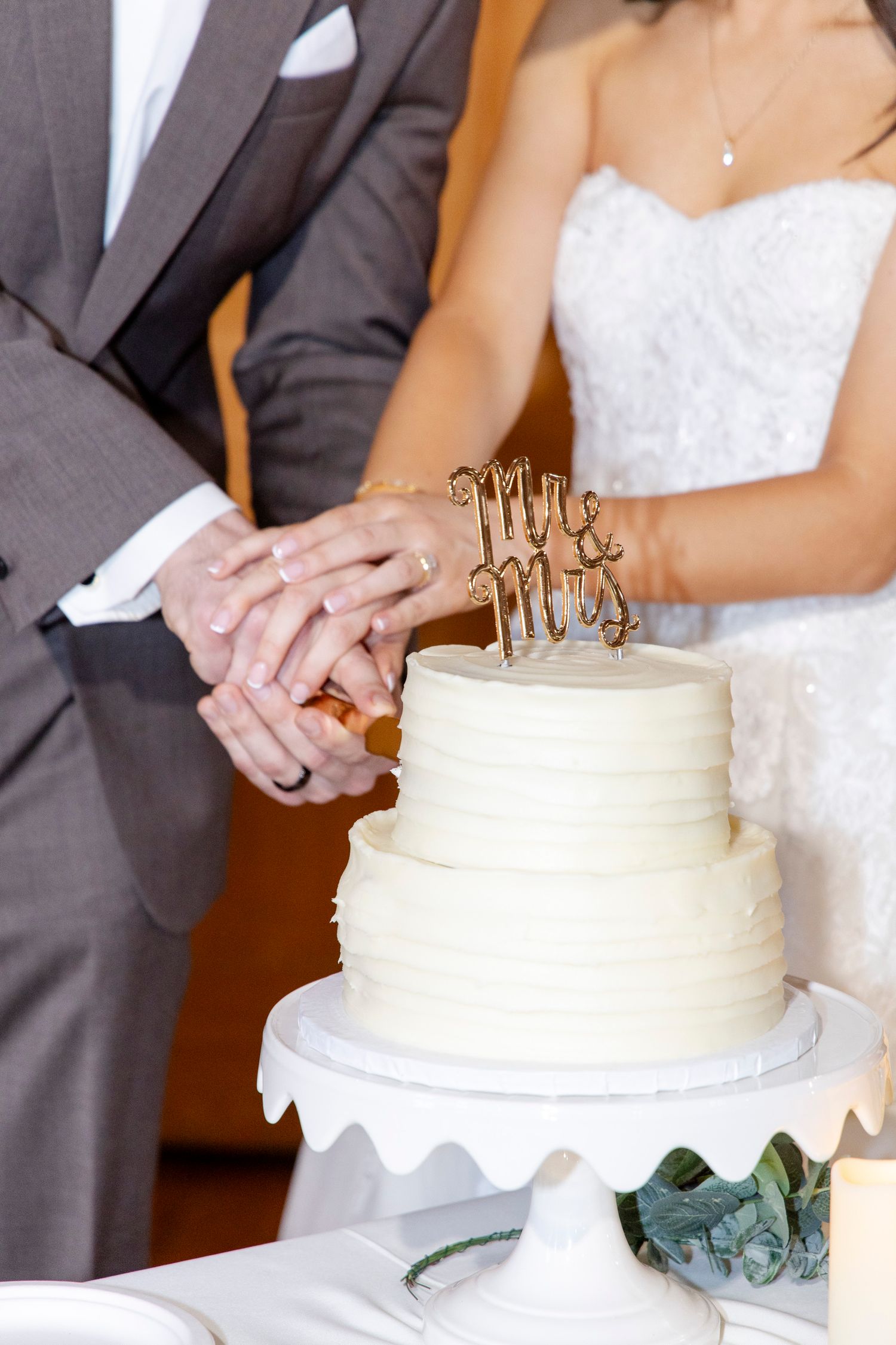 Dripping Springs Cake cutting luxury wedding.