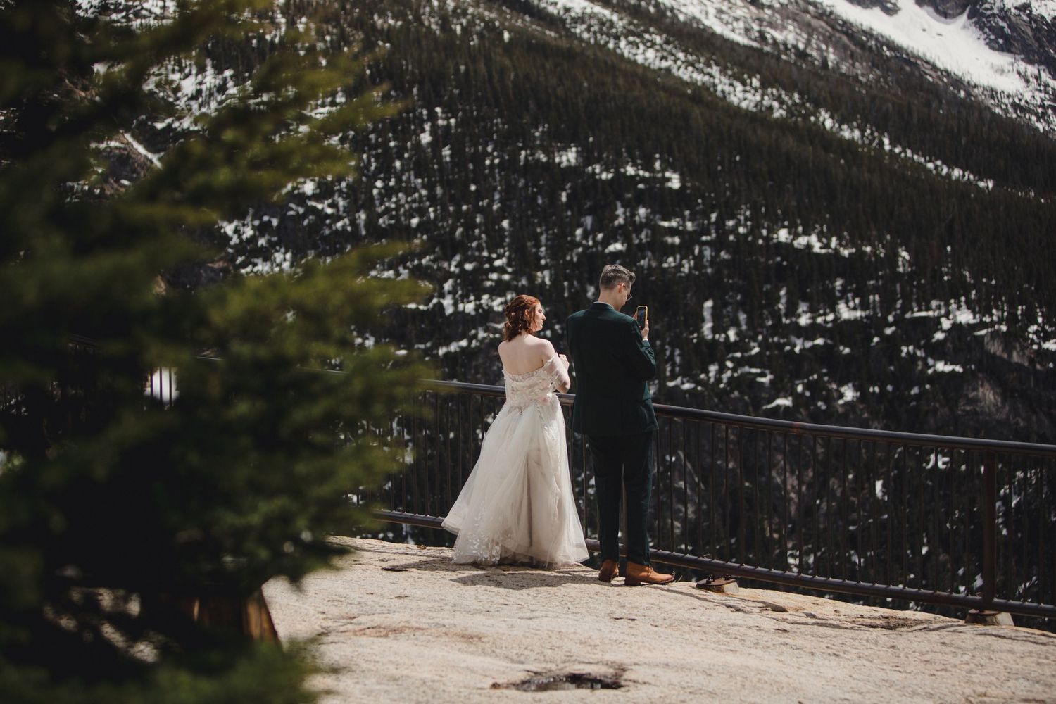 Wedding couple looks out at the view from Washington Pass on their elopement day.