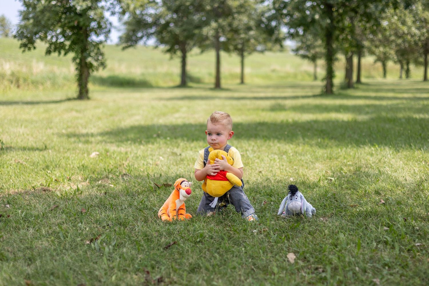 Springfield, IL Photographer captures a boy hugging his stuffed animal during a milestone session in Central IL
