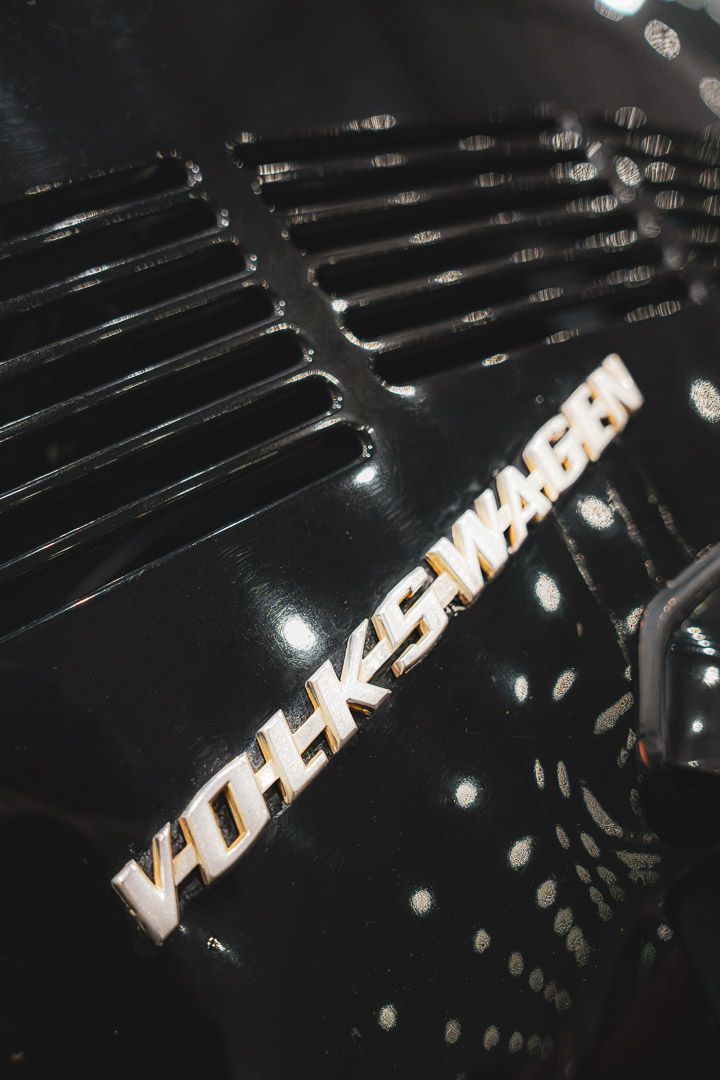 Close-up of a black vehicle with chrome 'Ultra' lettering on its surface.