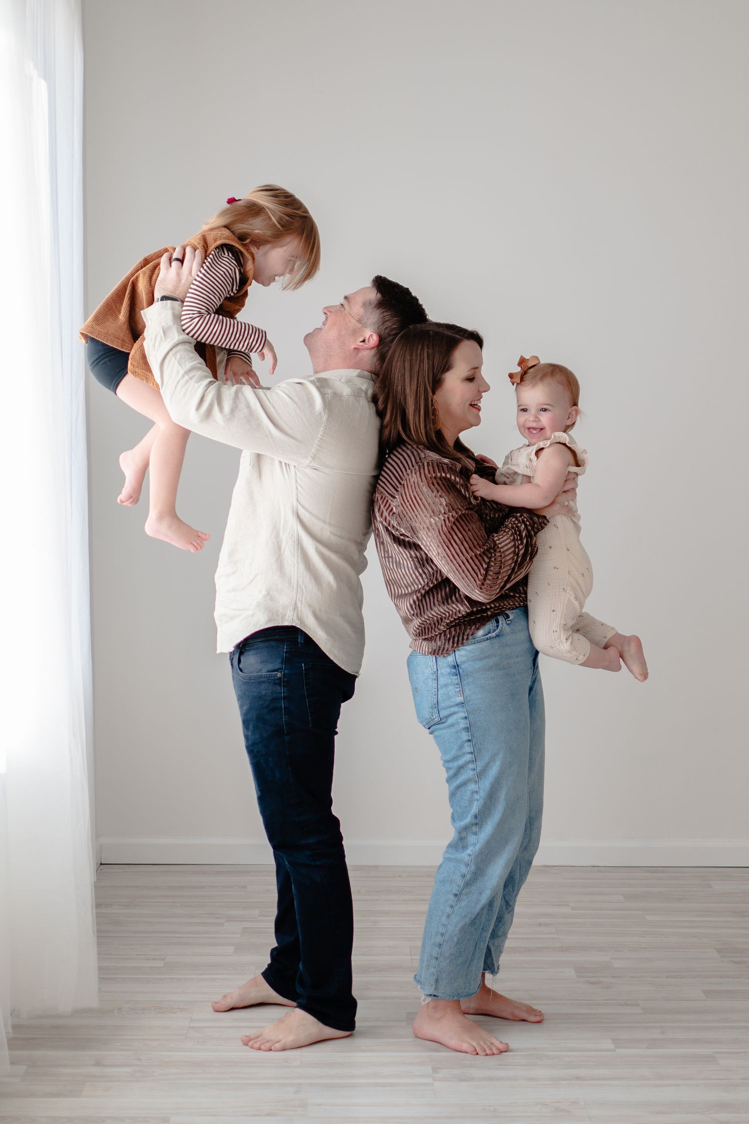 Three progressive images show a playful interaction between two people in a minimalist white room setting.