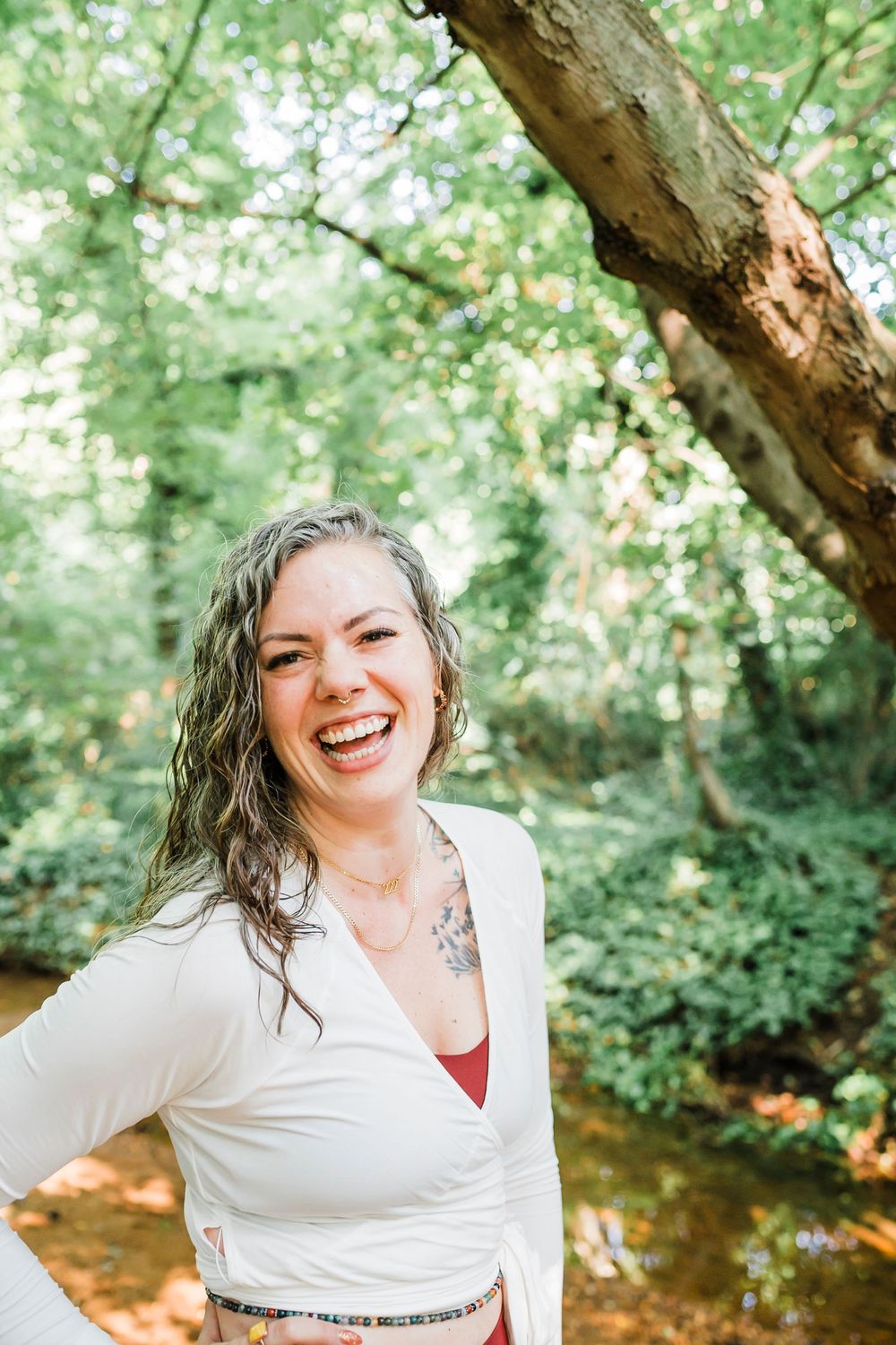 Natural outdoor portrait series with warm lighting and lush greenery backdrop creating a joyful summer atmosphere.