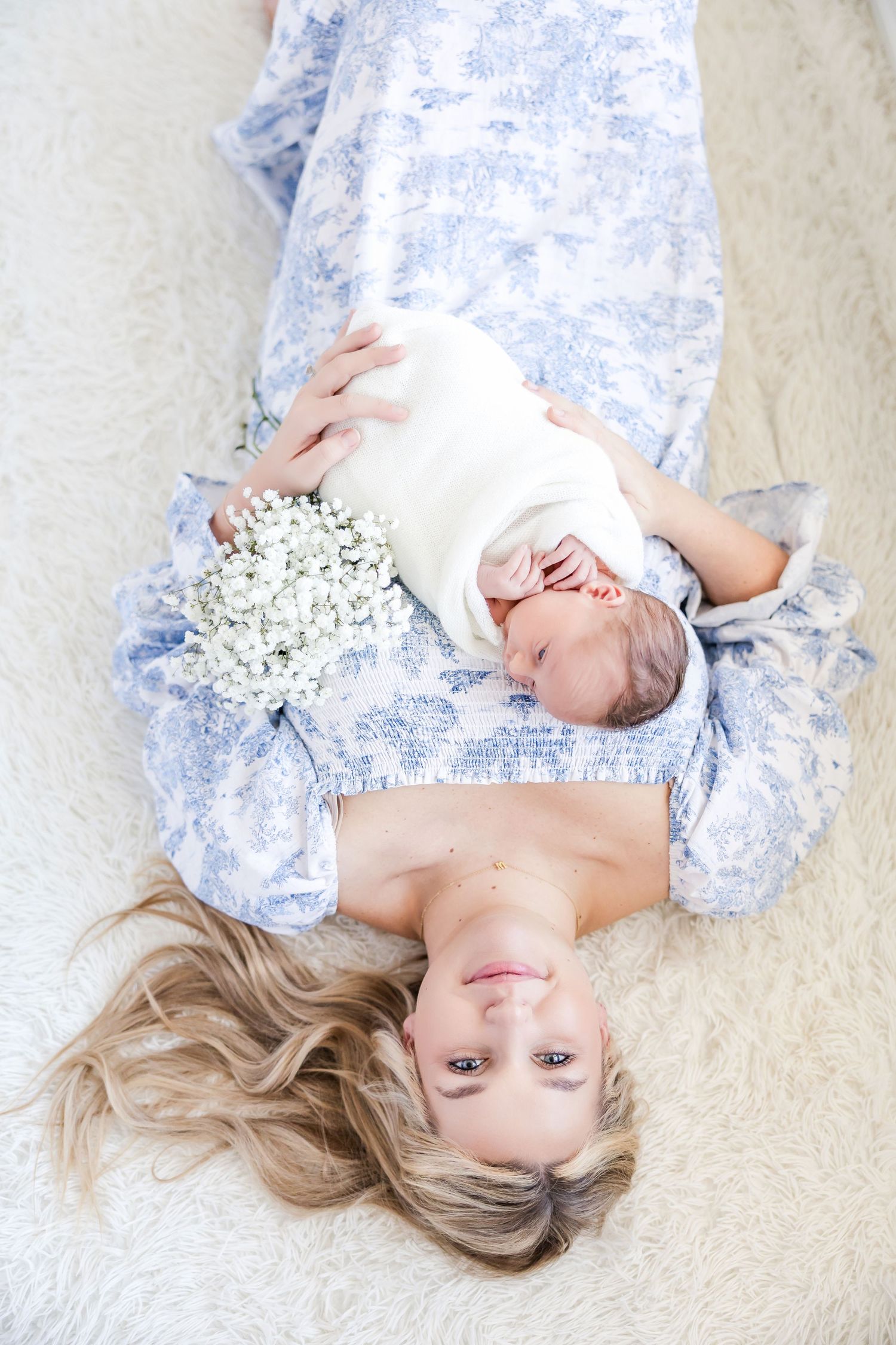 Sample at home lifestyle newborn photography session in Williamsburg. Photographer included a dog in this session.