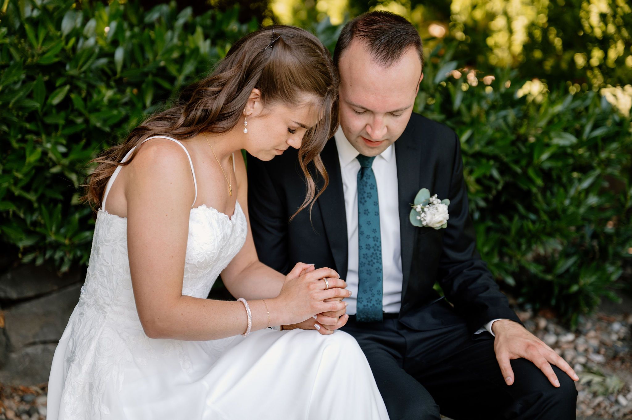 Bride and groom pray together before their wedding ceremony