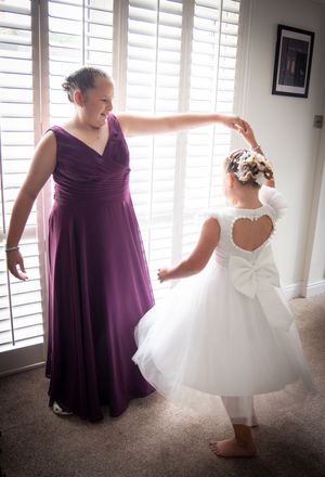 A sequence of photos showing bridesmaids in purple dresses helping adjust a white wedding gown during preparations.