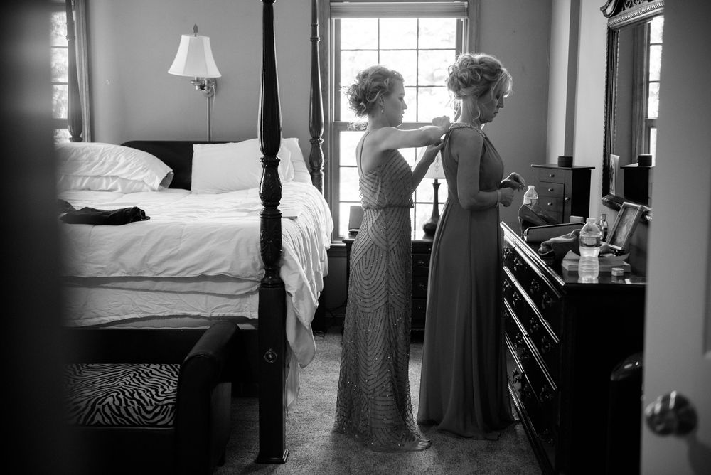 Black and white interior shots of a classic hotel room with window light.