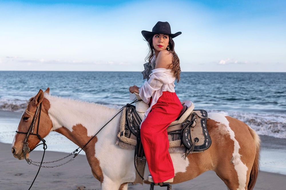A series of beach horseback riding photos showing riders in red dresses on tan horses along the ocean shoreline.