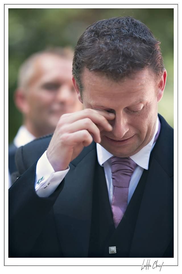 Emotional groom wiping tears during ceremony at Château de Pouget, South of France destination wedding photography