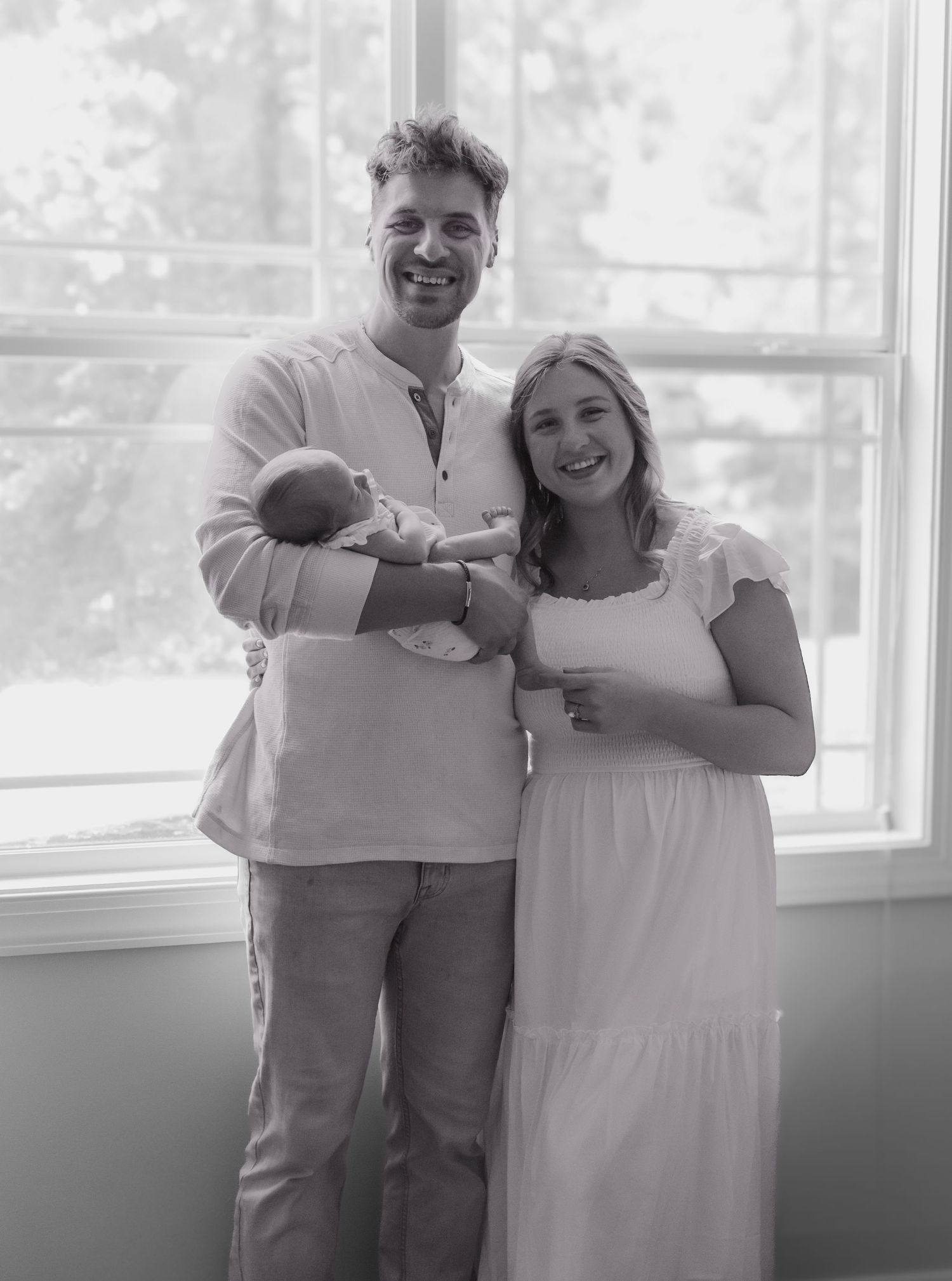 Black and white series capturing intimate moments between parent and baby.