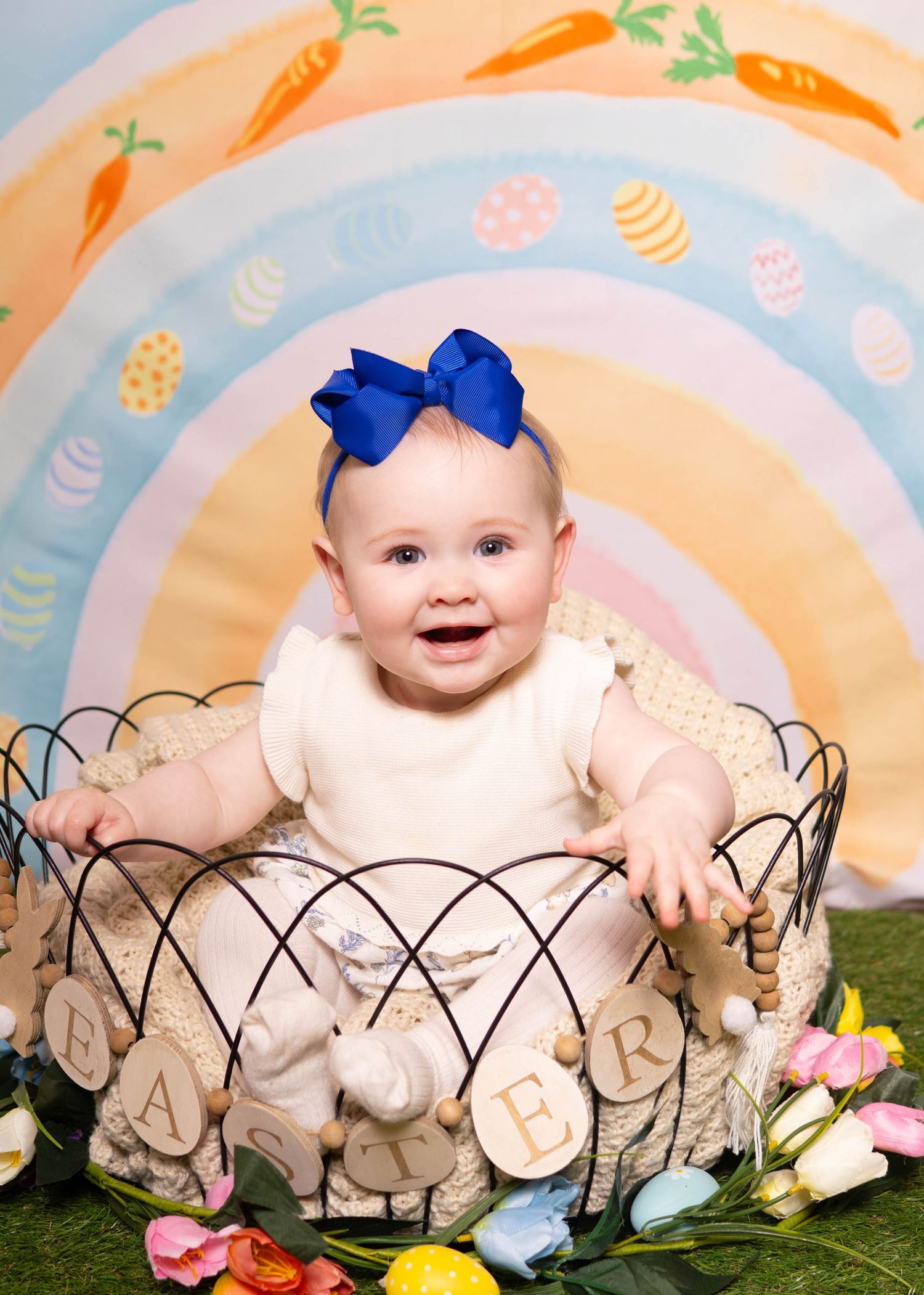 Easter Mini Session - Spring photo session with wire basket and carrot pattern backdrop.