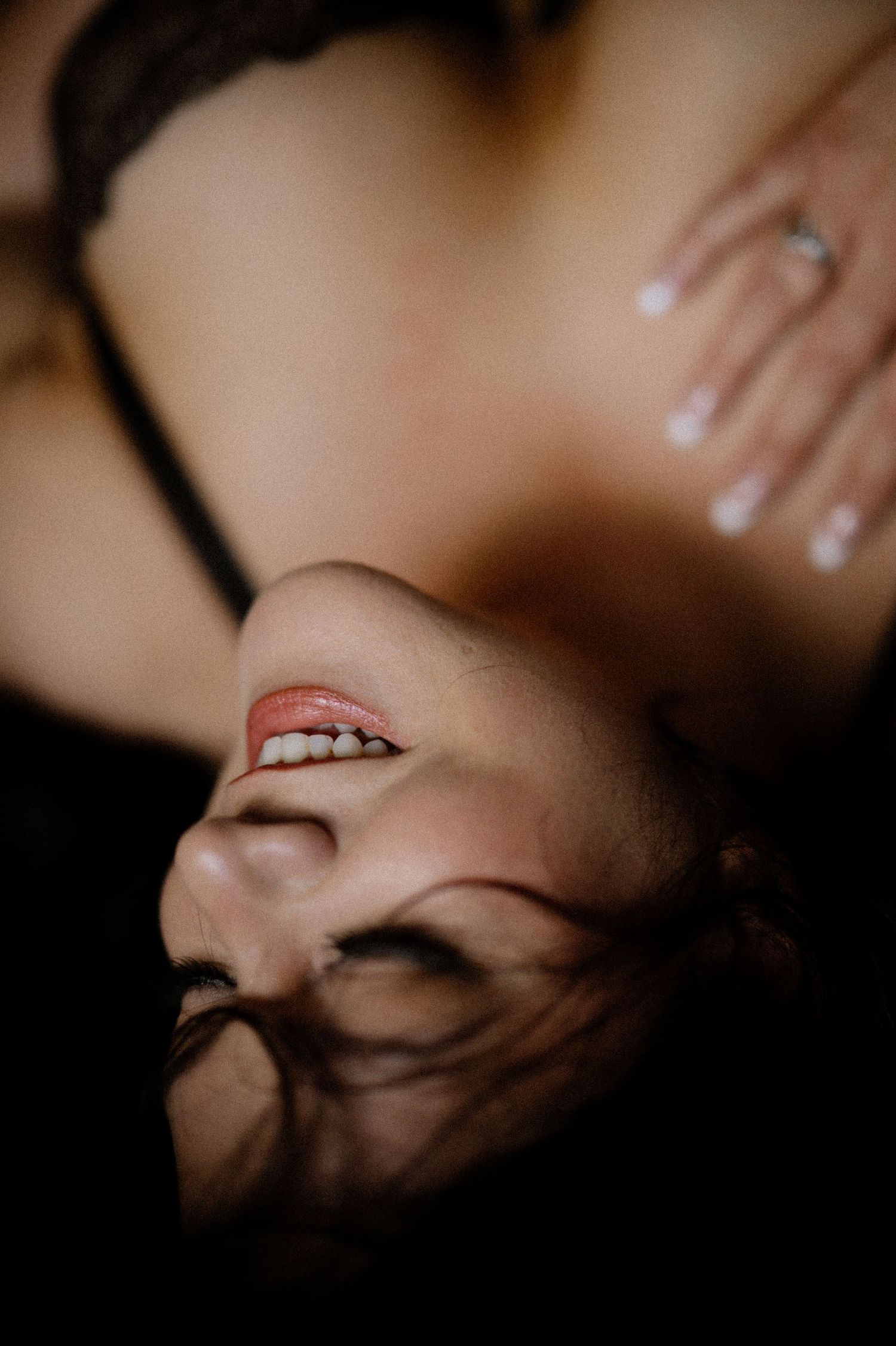 A series of artistic close-up beauty shots showing glossy lips and facial features in dramatic shadows and lighting.