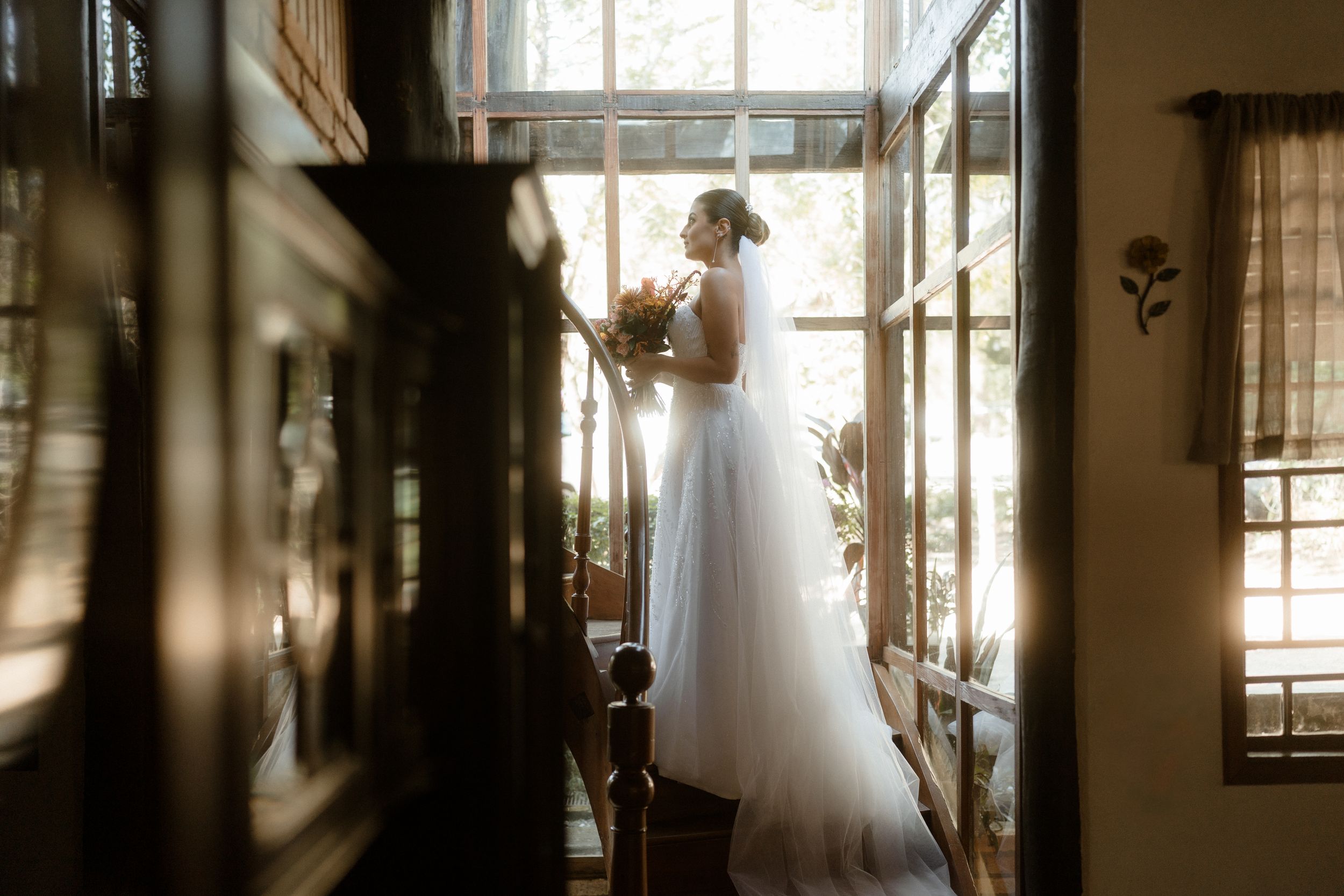 Atmospheric wedding venue interior with window light and shadow play.