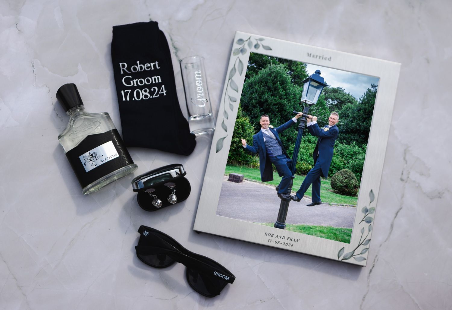Photography equipment and printed photos laid out on white surface.