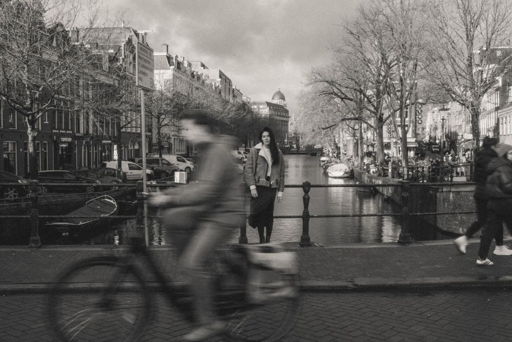 Black and white panoramic series of Amsterdam canal scenes with motion blur effects.