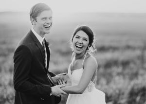A couple shares romantic moments in a scenic outdoor setting.