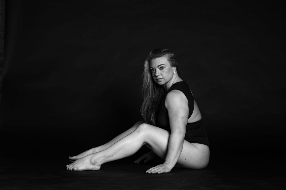 Black and white luxury editorial boudoir photograph by Mimi Frank Photography in Edmonton, Alberta, Canada