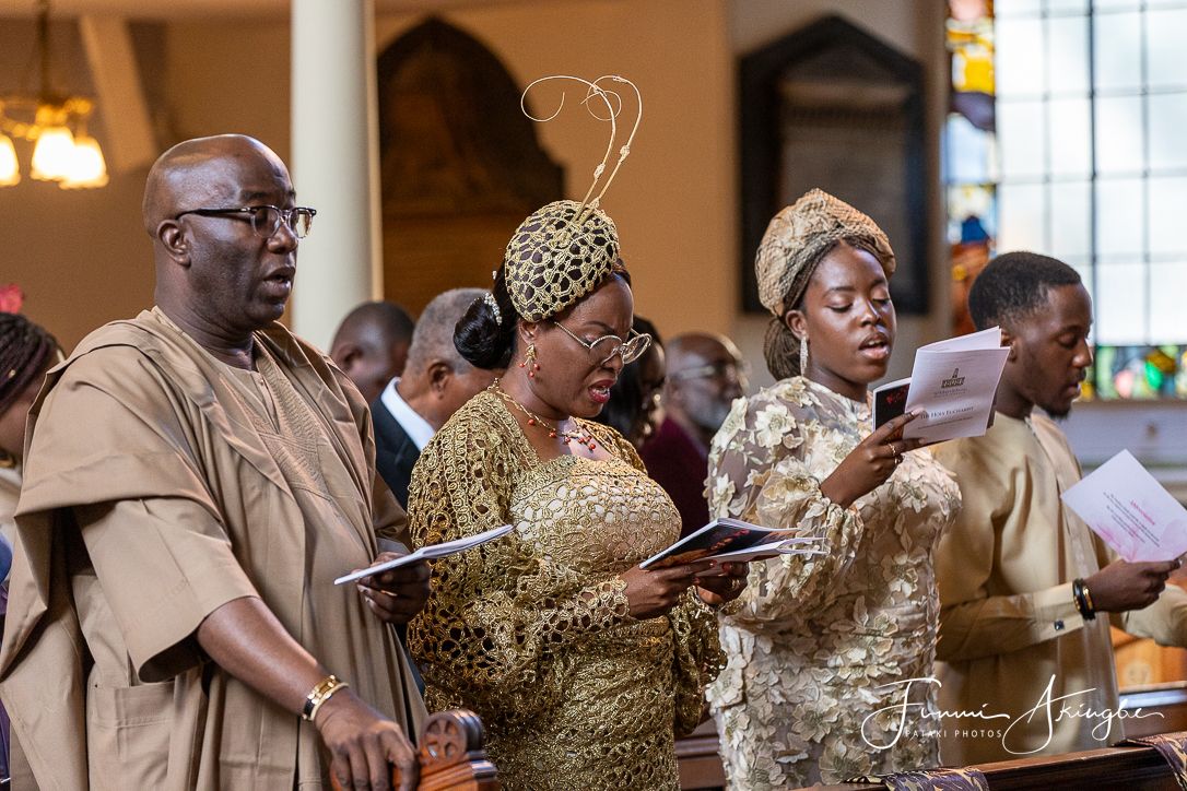 Celebrant's immediate family singing during her 50th birthday church thanksgiving service captured by Funmi Akingbe for Pataki Photos