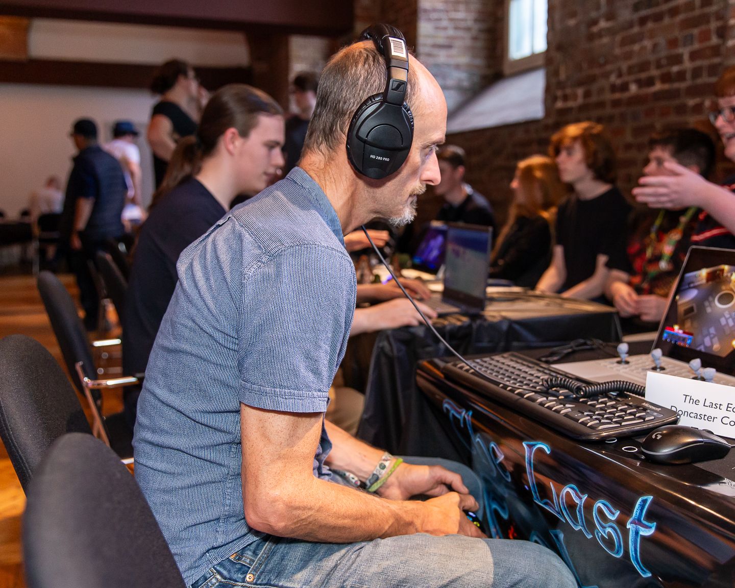 Guest at the NextGen skills academy graduate showcase event held in London, playing a video game designed by one of the students