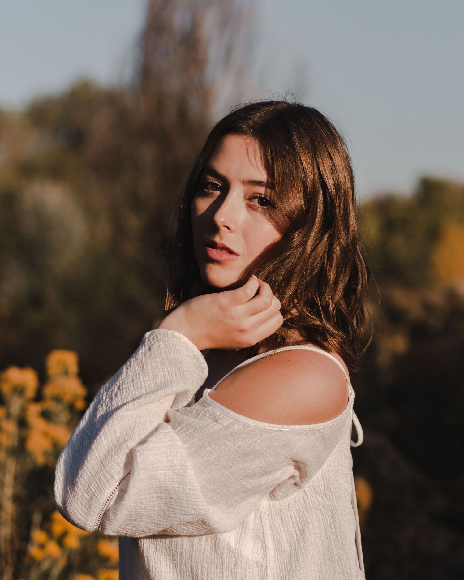 Minimalist creative portrait with strong eye contact and natural tones | high-end creative portrait photographer
