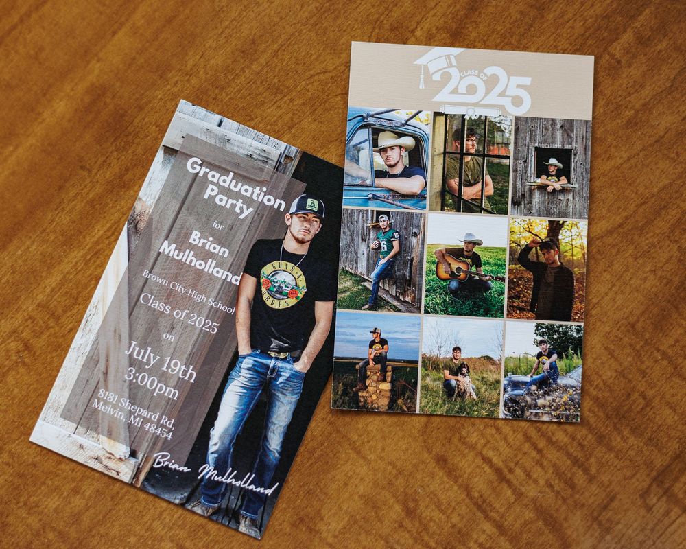 Senior graduation photo announcement cards with class of 2025 design displayed on wooden floor.