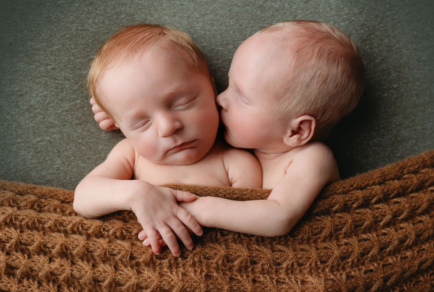 The twins snuggled together, kissing. Greenville SC newborn photographer, Easley SC newborn photographer