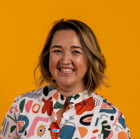 A smiling professional headshot of a woman