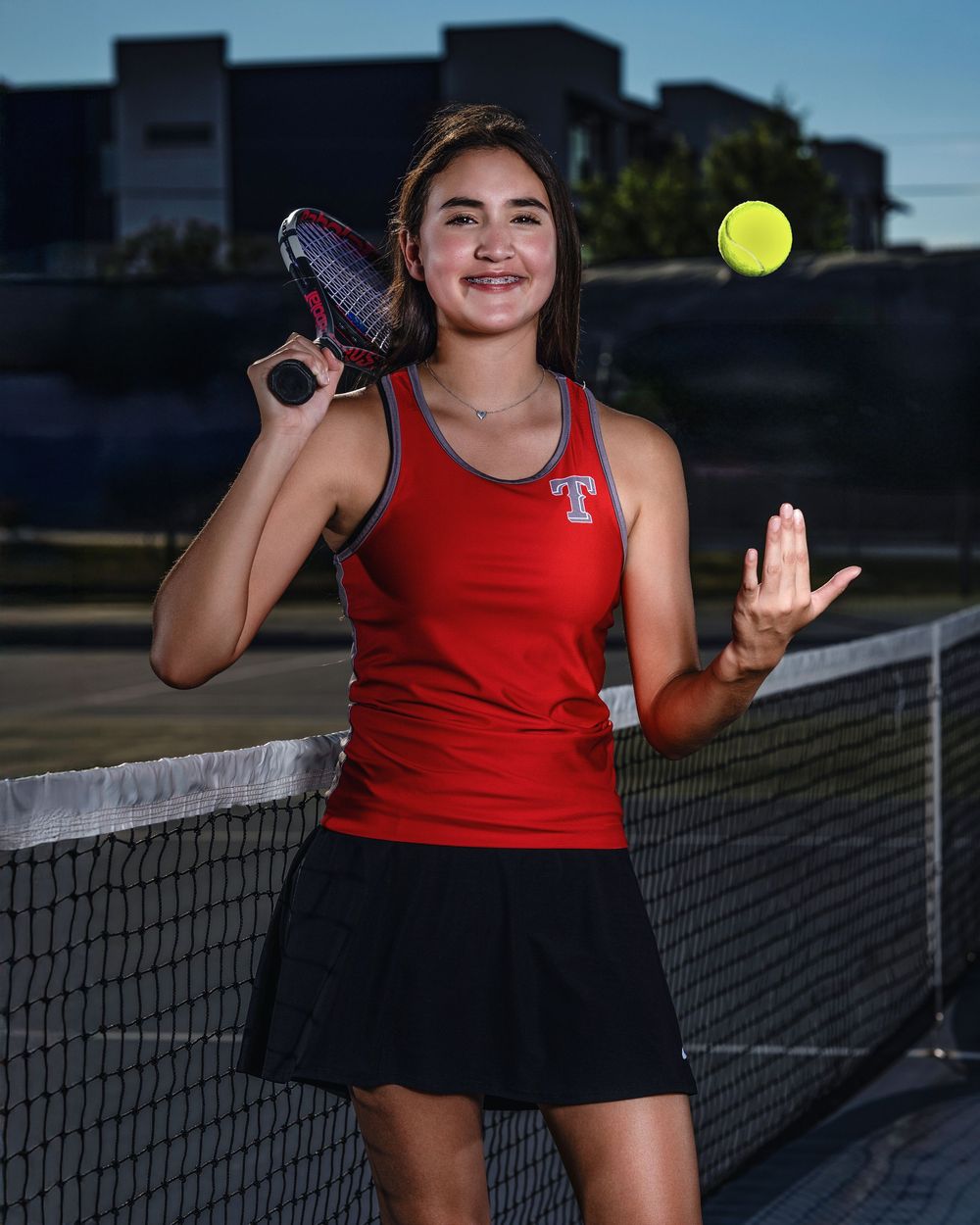 Multiple action shots show a tennis player in red athletic wear practicing serves and volleys on an outdoor court.
