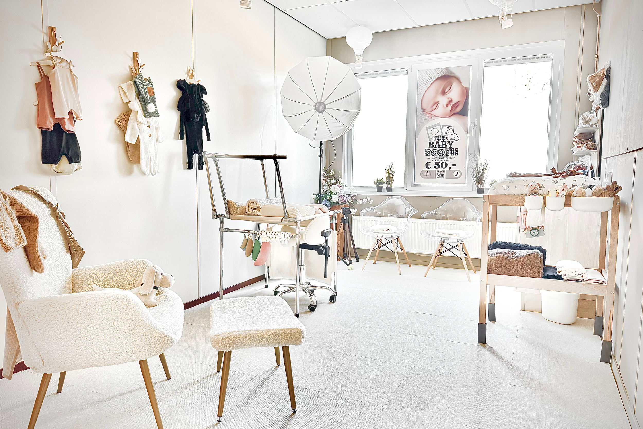 Bright minimalist retail boutique interior with white walls, wooden shelves, and neutral decor accents.