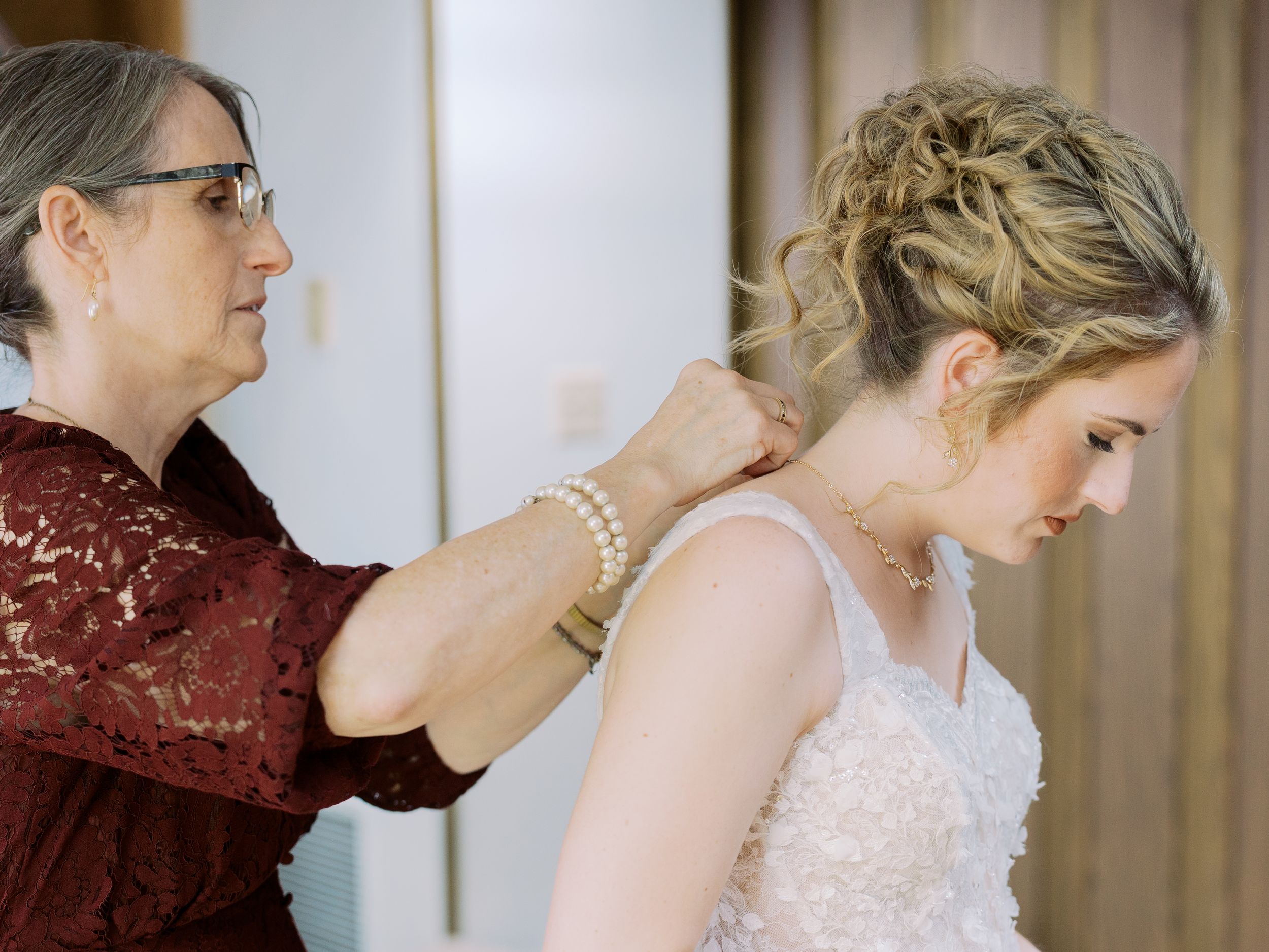 A series of candid moments during a wedding preparation showing people getting ready in elegant formal attire.
