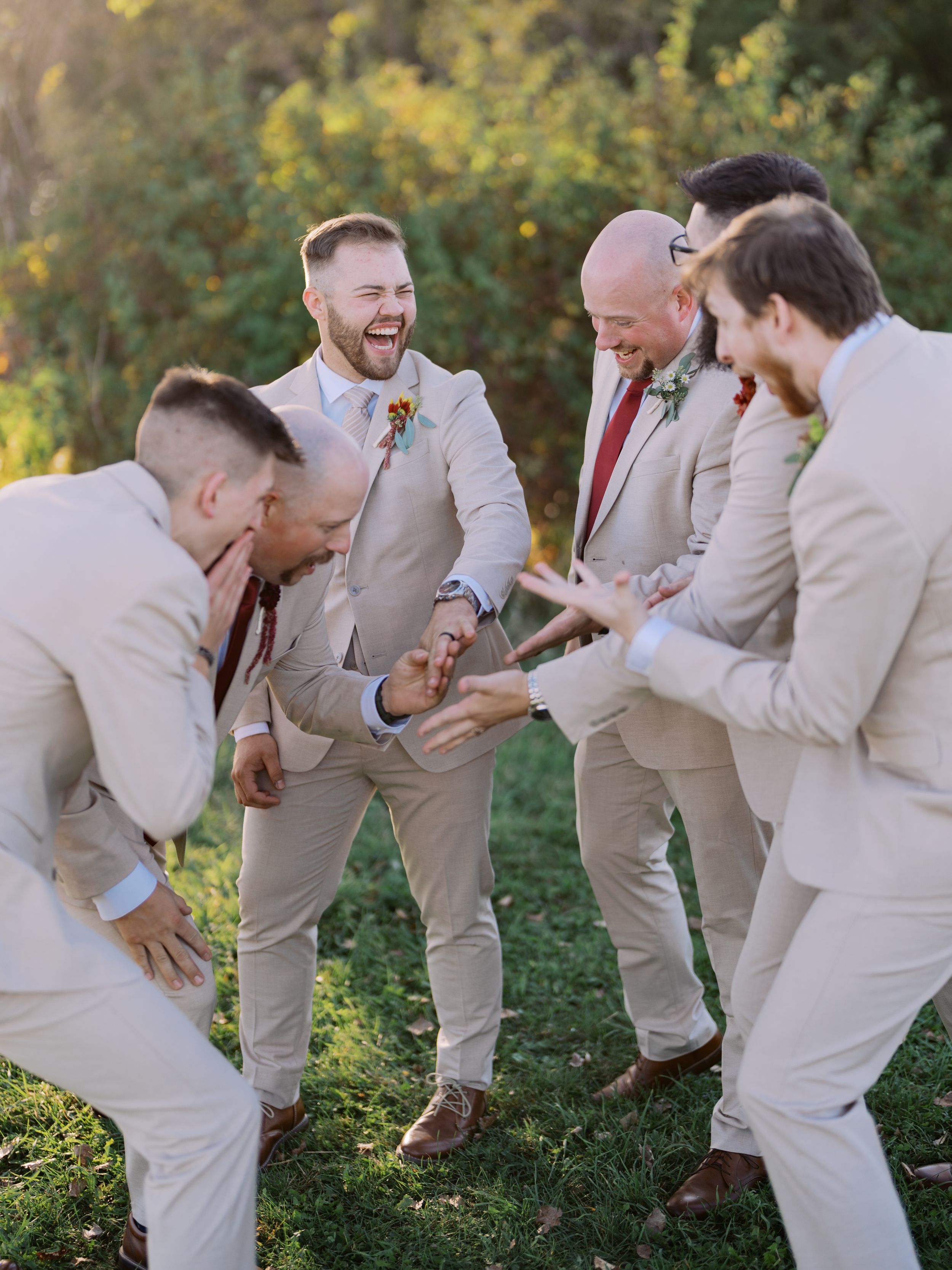 Groomsmen in beige suits playfully pose in a sequence of candid photos in an outdoor garden setting.