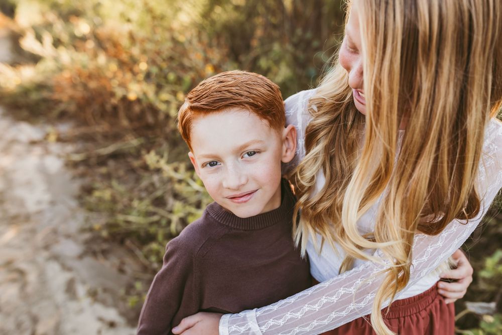 A collage of candid outdoor family moments with warm autumn colors and natural lighting.