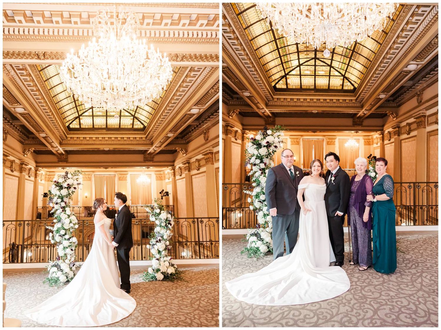 Elegant wedding couple and guests pose in a grand historic ballroom with ornate skylights and decorative floral arrangements.