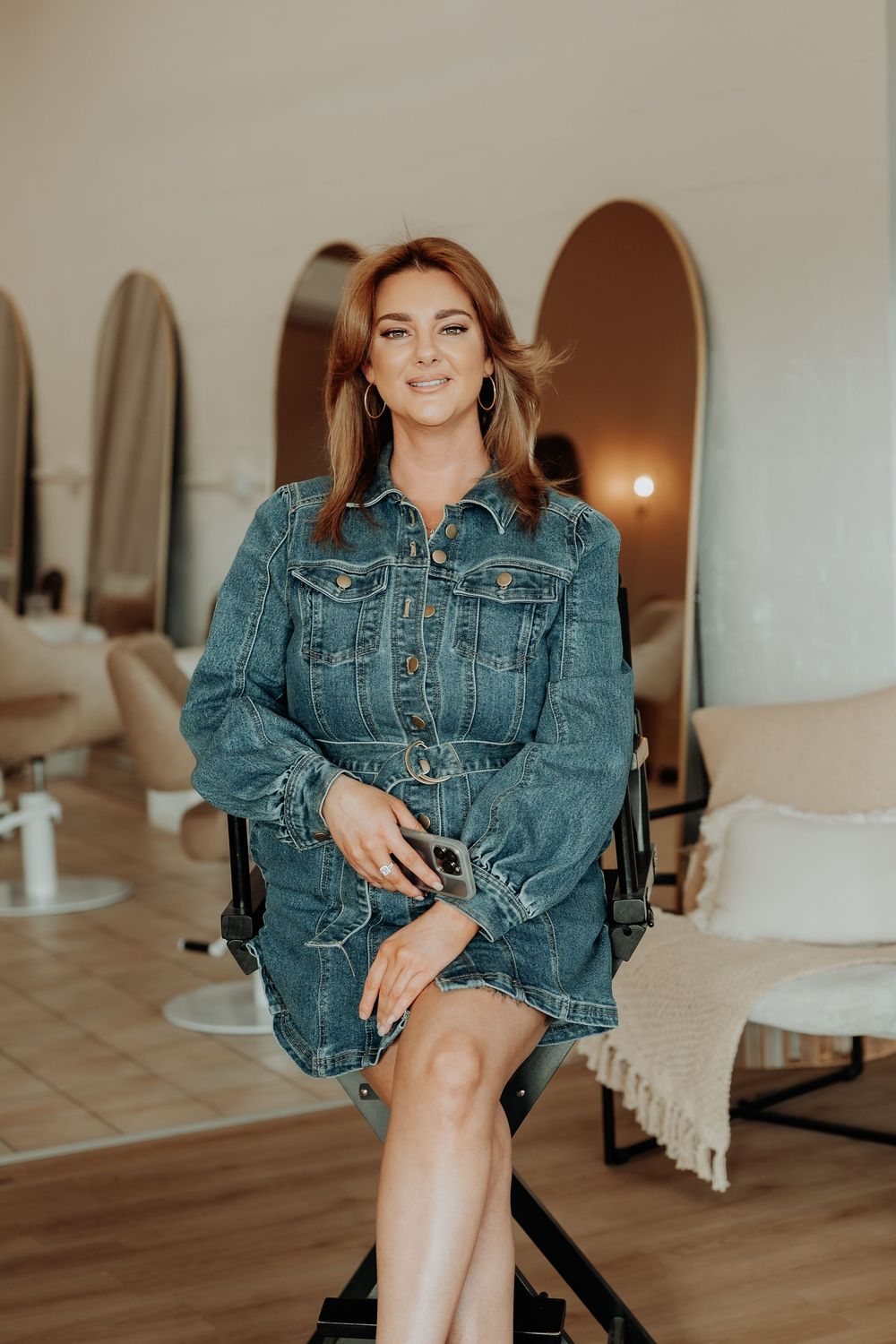 Fashion gladstone photography session in modern studio space featuring denim jacket styling.