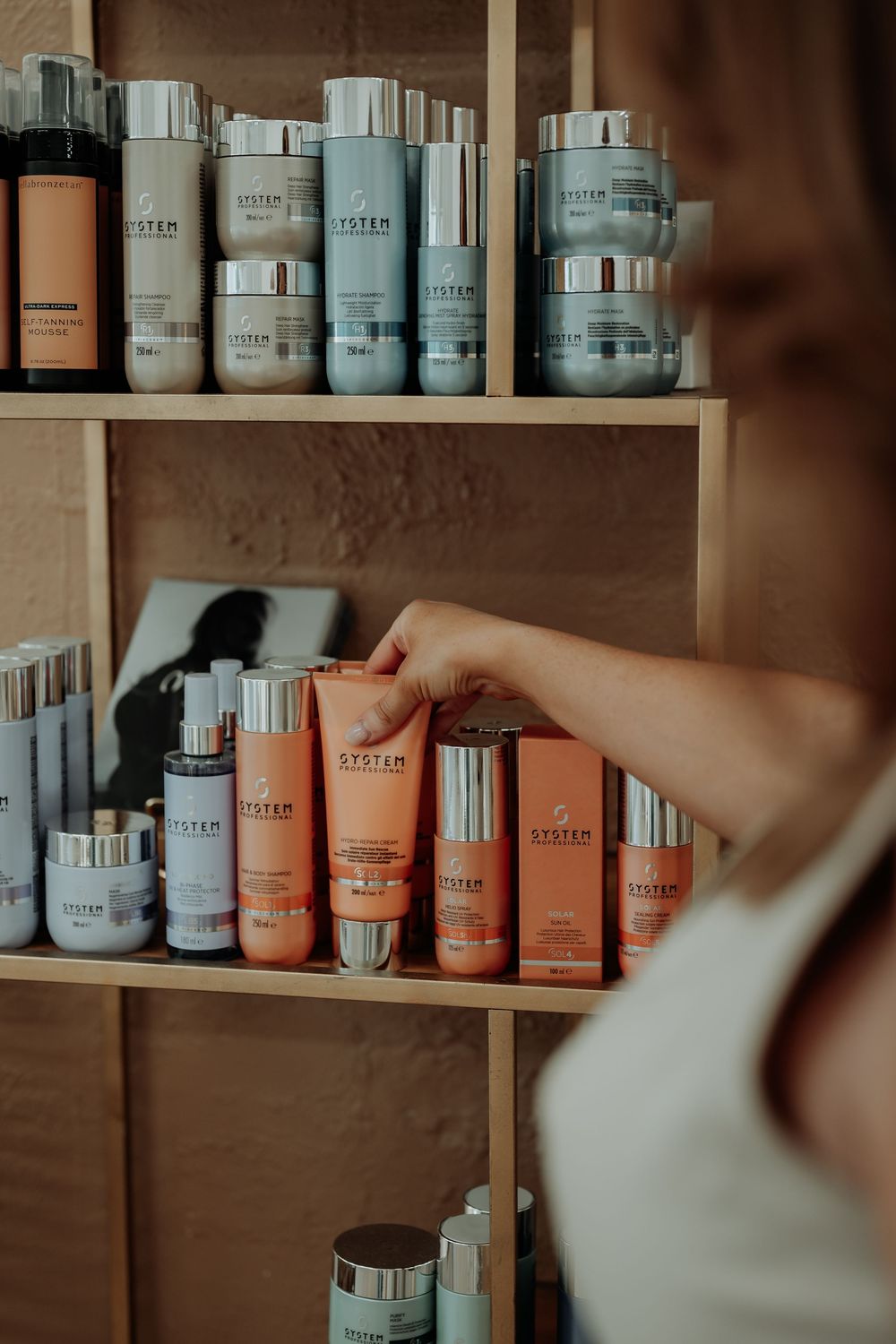 Professional beauty product display shelves stocked with coordinated skincare containers.