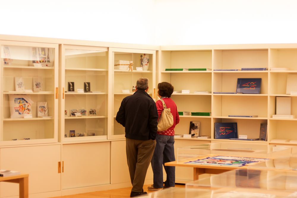 Empty wooden shelving units line the walls of a retail space.