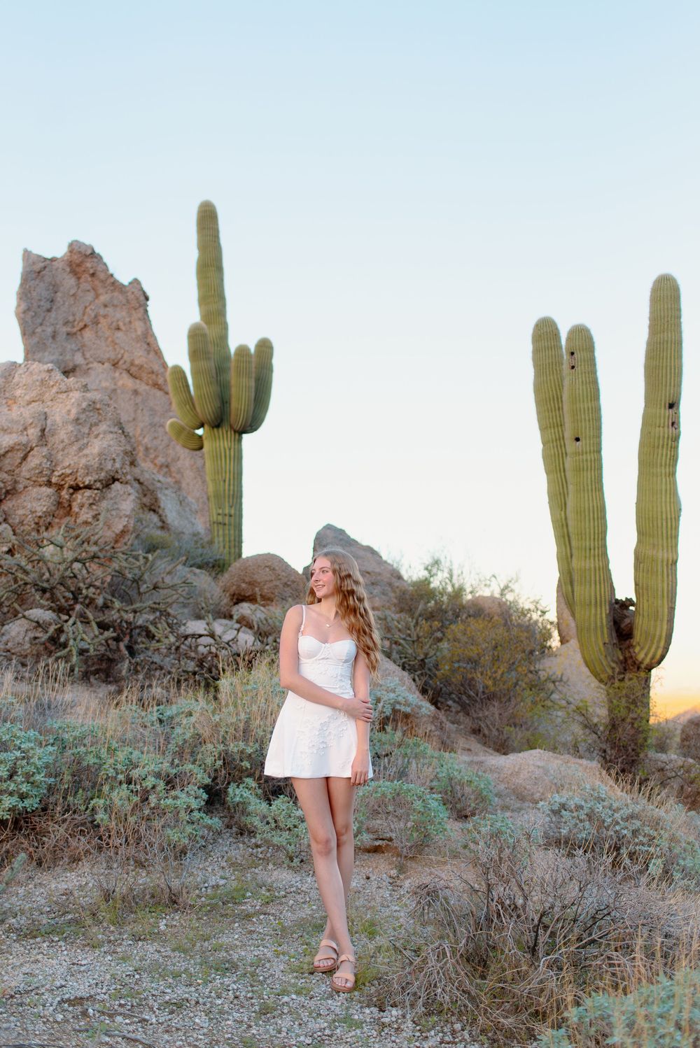 Image of a high school senior taking her senior photos at the McDowell Sonoran Preserve in Scottsdale, Arizona.