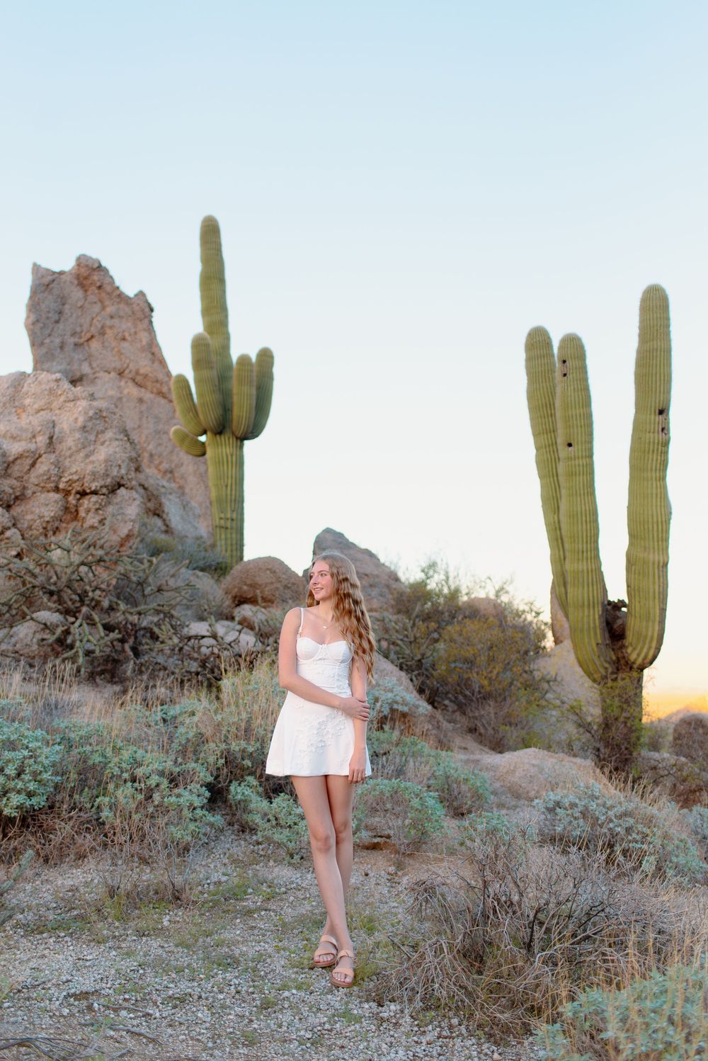 Image of a high school senior taking her senior photos at the McDowell Sonoran Preserve in Scottsdale, Arizona.