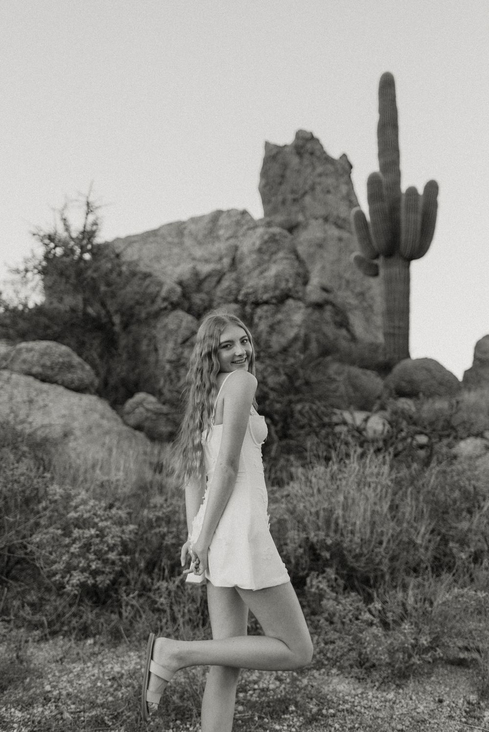 Image of a high school senior taking her senior photos at the McDowell Sonoran Preserve in Scottsdale, Arizona.