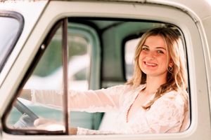 Vintage truck portrait with soft natural lighting and white lace details.