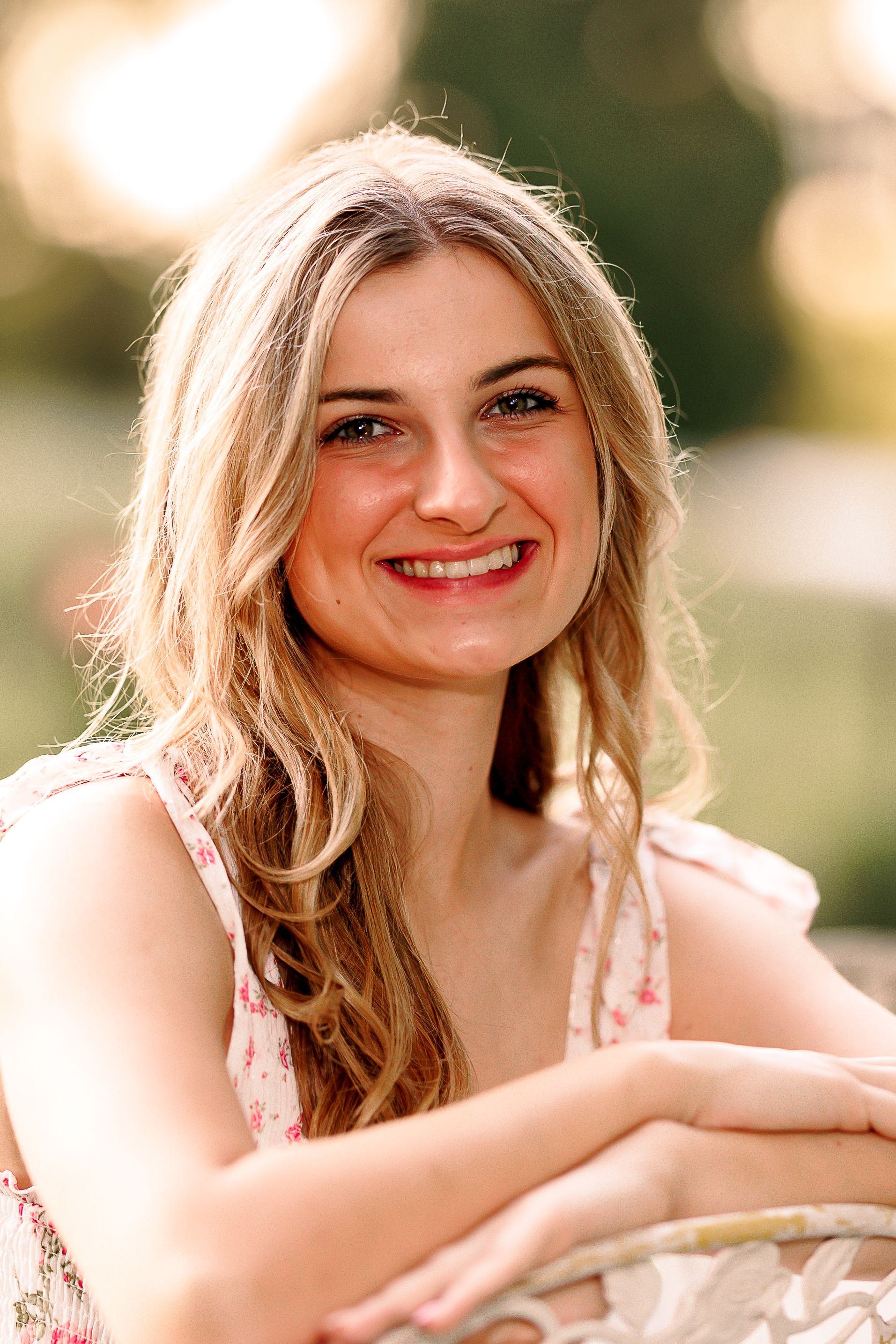 Warm sunset portrait with soft bokeh lighting effects.