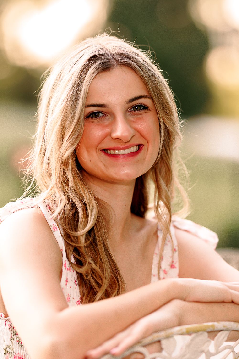 Warm sunset portrait with soft bokeh lighting effects.