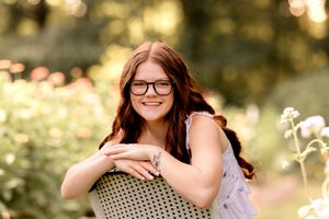 Outdoor portrait session with dreamy golden hour lighting and bokeh effect.