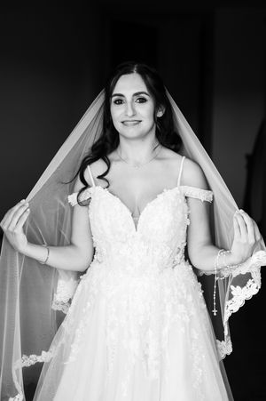 A series of bridal portraits showing a bride in a white lace wedding dress and veil against a dark background.