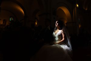 Dramatic low-light wedding reception photos with spotlit dancing moments.