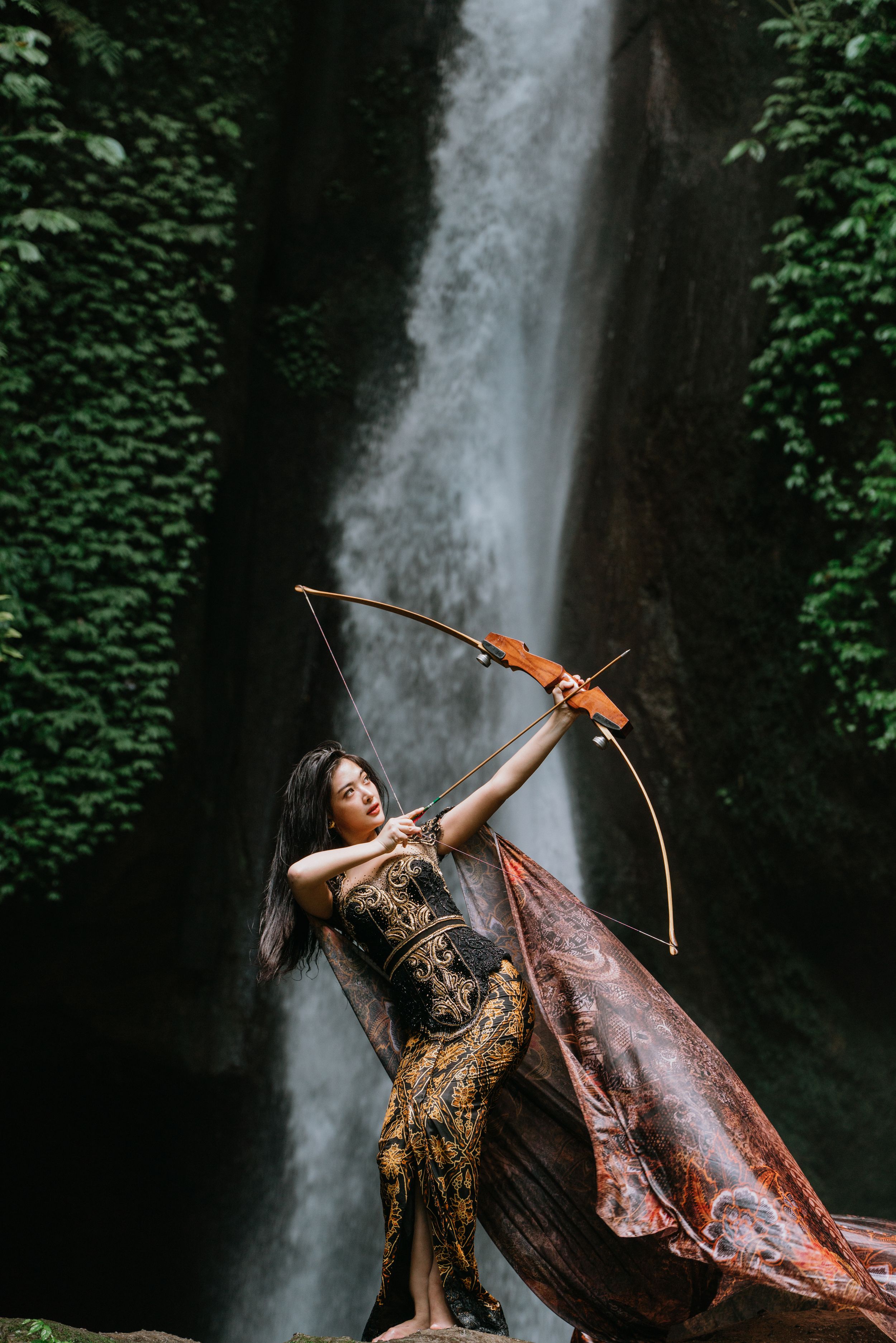 Personal branding photography with waterfall natural Bali light