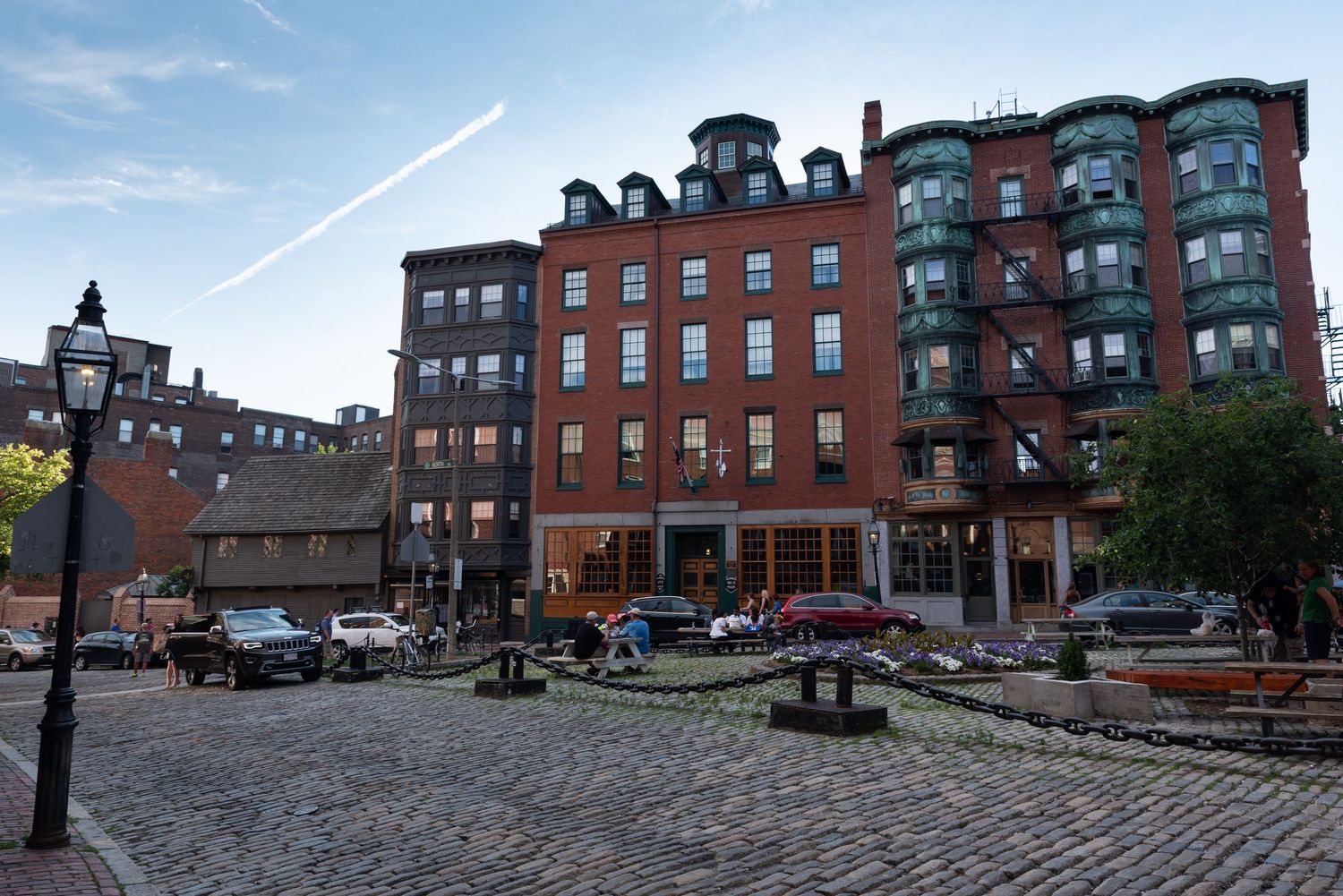 Boston's North Square is on the Freedom Trail and includes Paul Revere's House. This historic location is in the iconic North End.