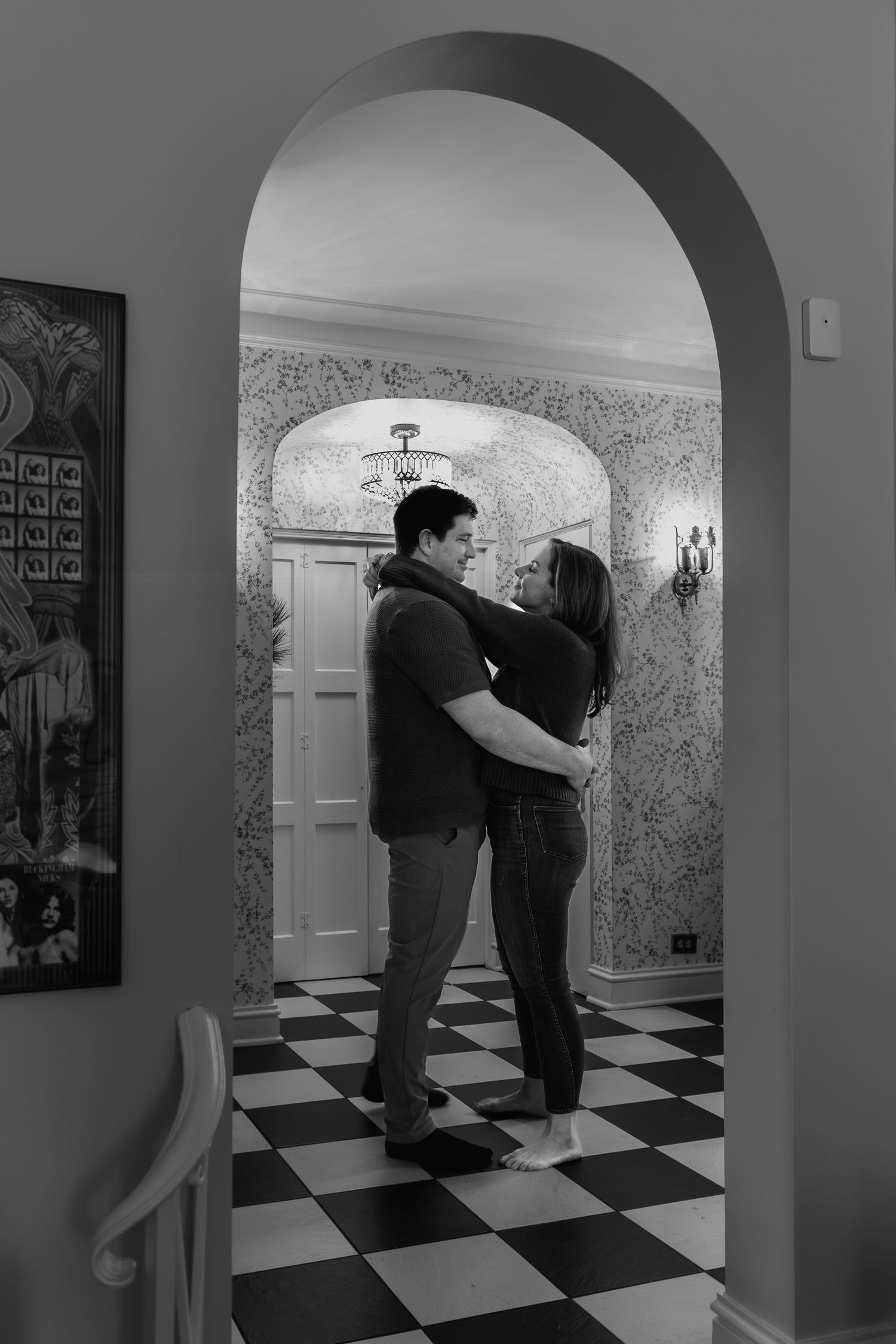 A series of black and white photographs showing a person walking through an archway in a room with checkered floors.