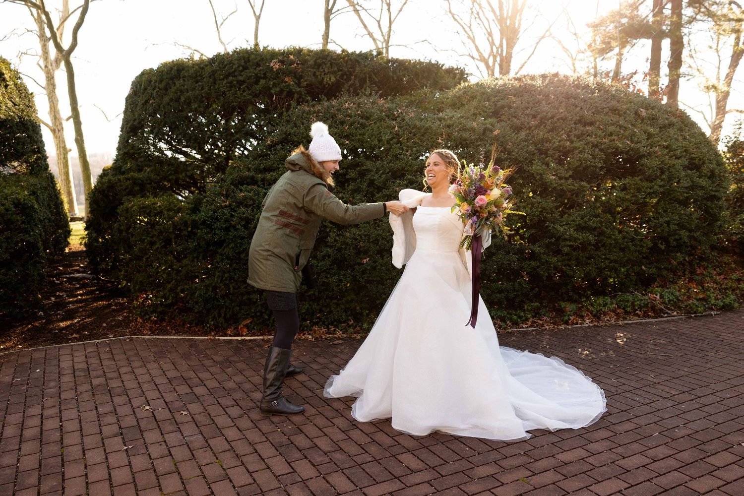 A series of romantic wedding photos showing a couple in formal attire walking and posing on a brick pathway at sunset.